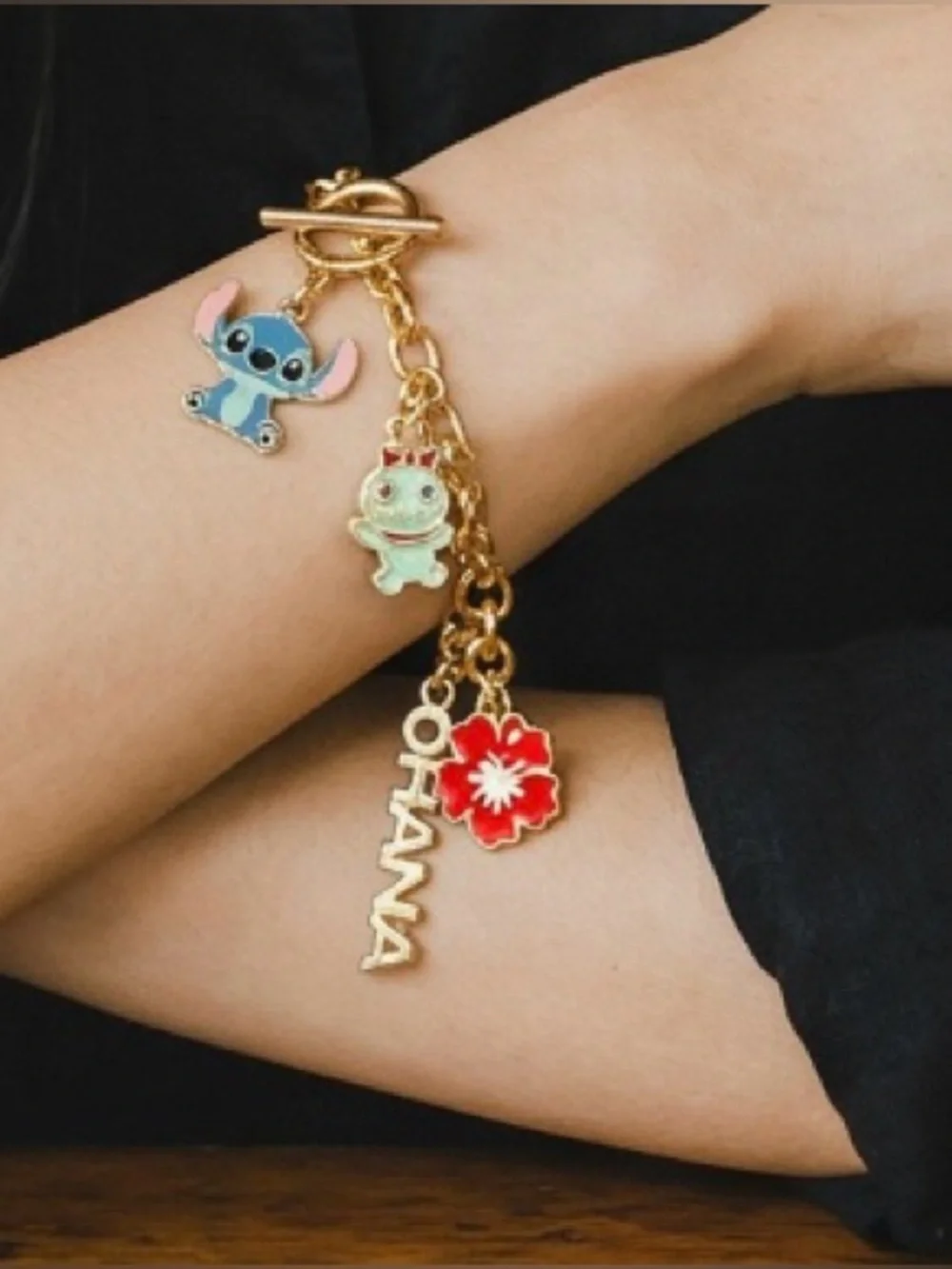Gold Charm Bracelet with Blue Stitch and Red Flower Charms